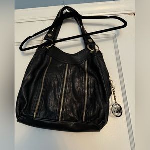 Michael Kors Black leather Bag with zipper detail all around. Great condition!